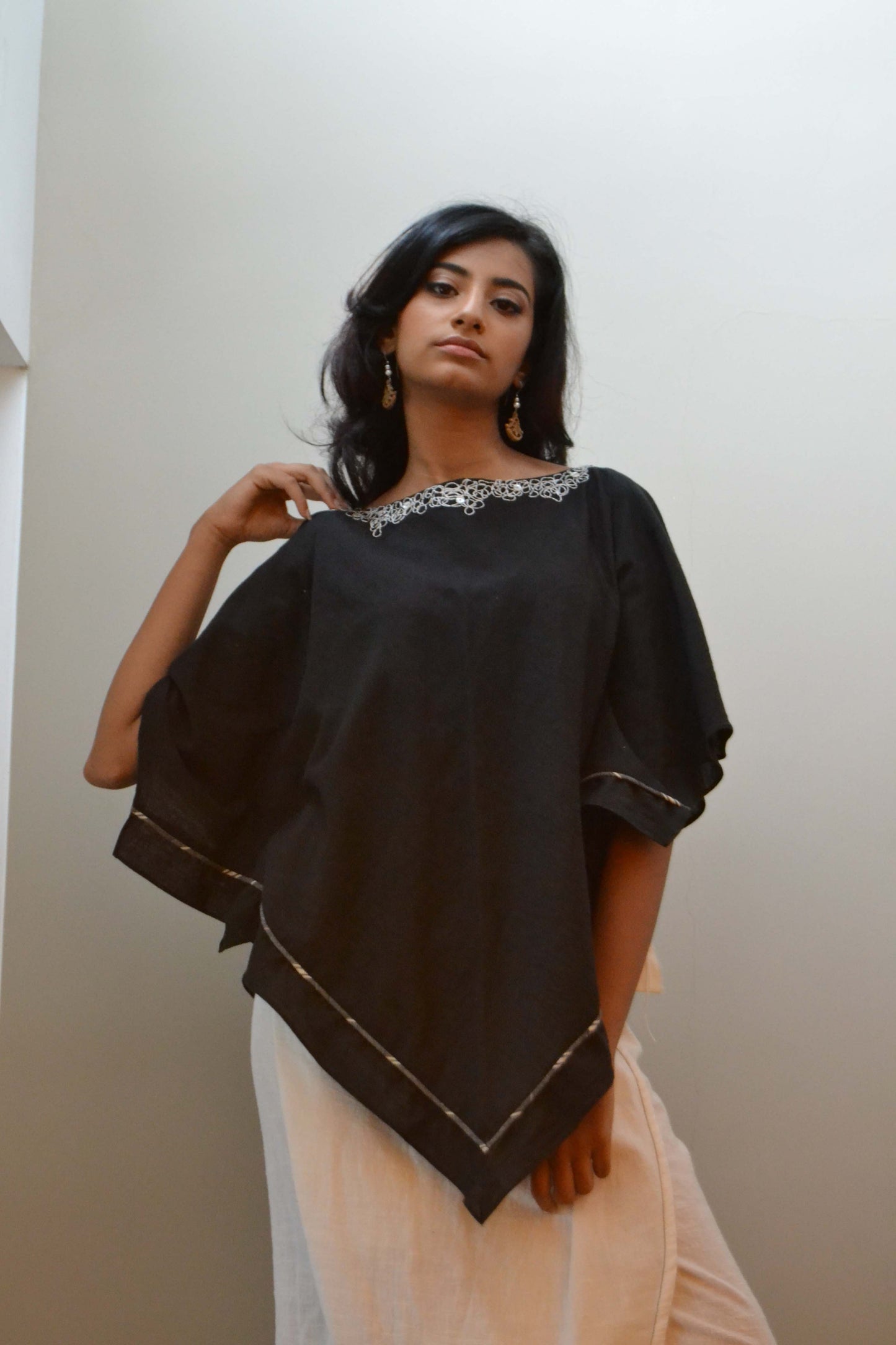 Square bias cut tunic with loose
thread embroidery