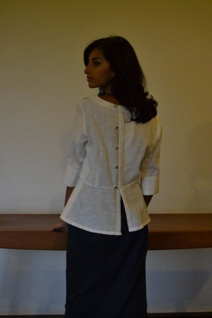 Peplum style tunic with loose thread embroidery and back button opening