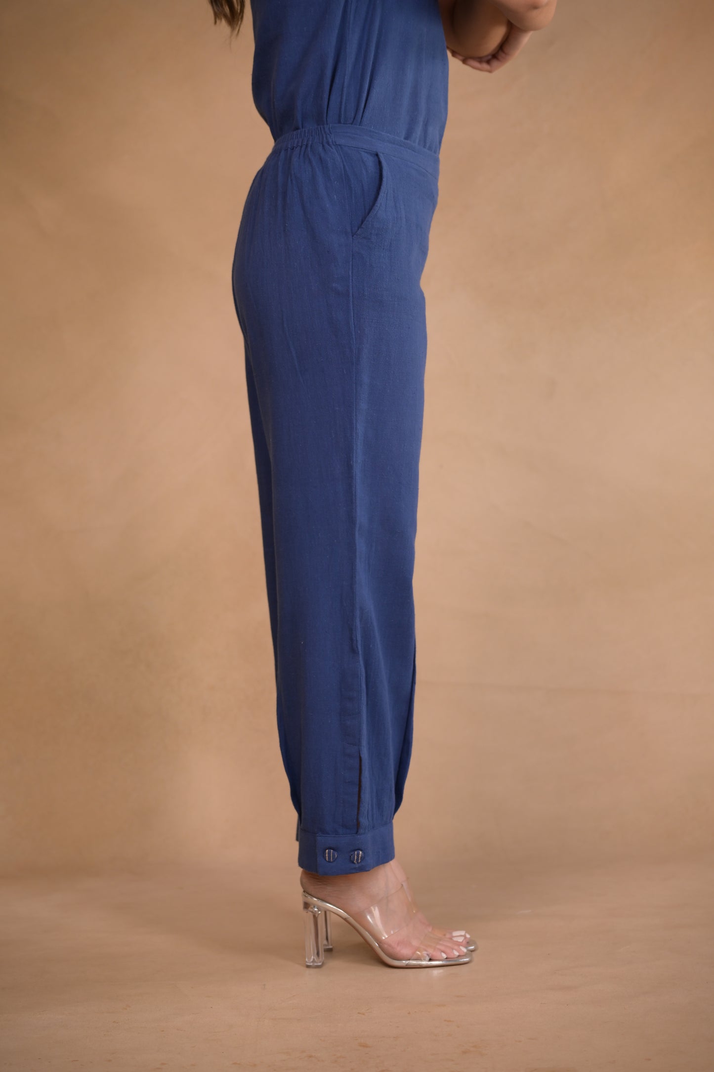Pant, in pleat and button detail at hem