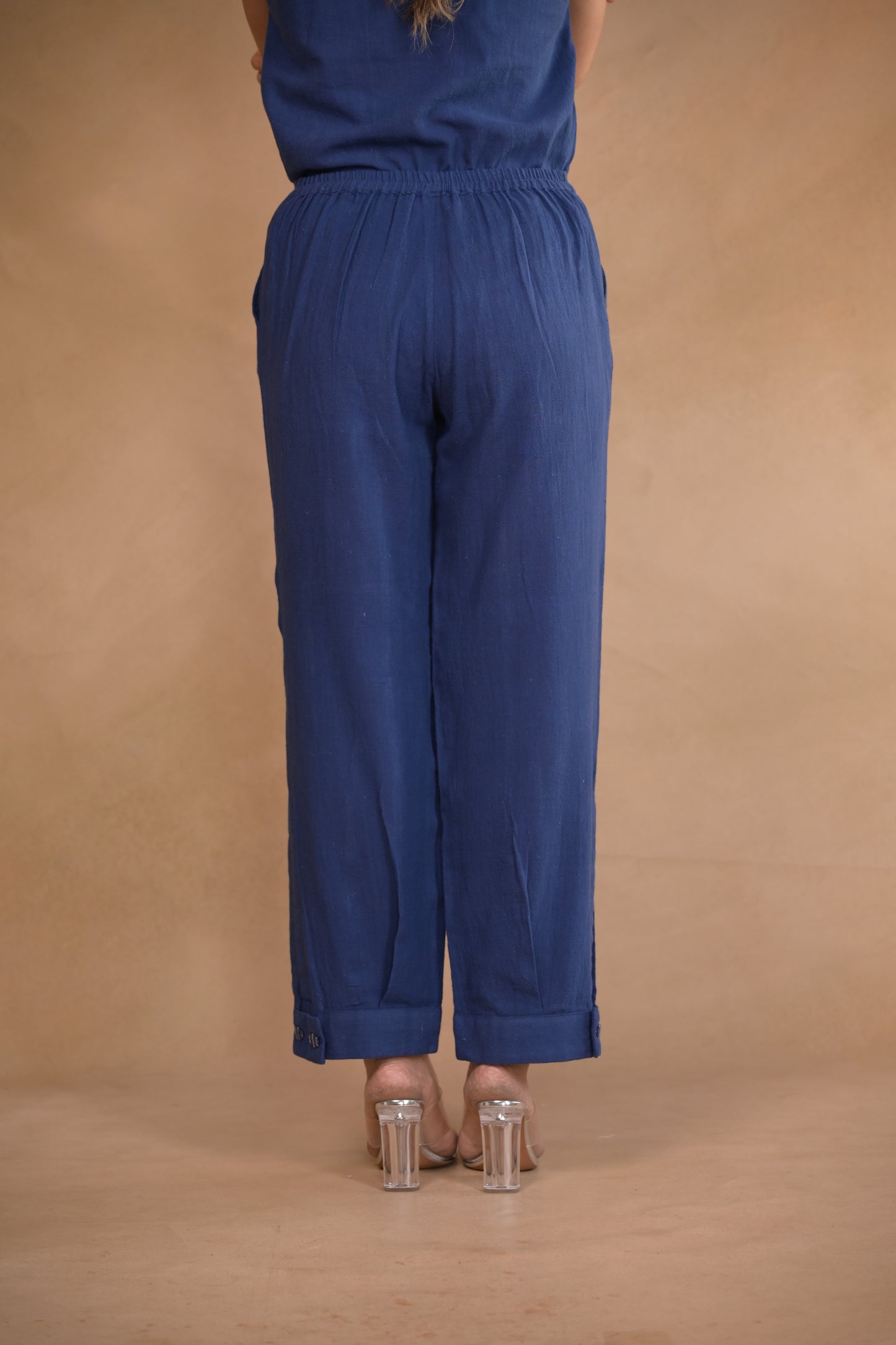 Pant, in pleat and button detail at hem