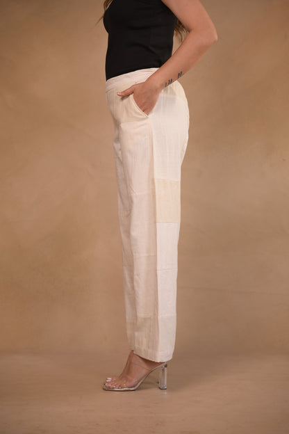 Pant, in pleat and button detail at hem