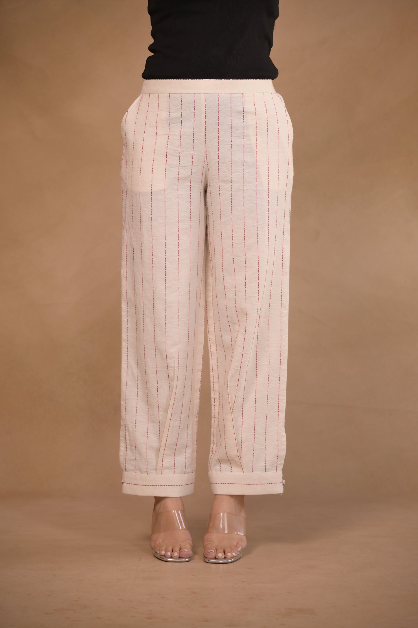 Pant, in pleat and button detail at hem