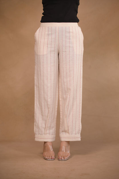 Pant, in pleat and button detail at hem