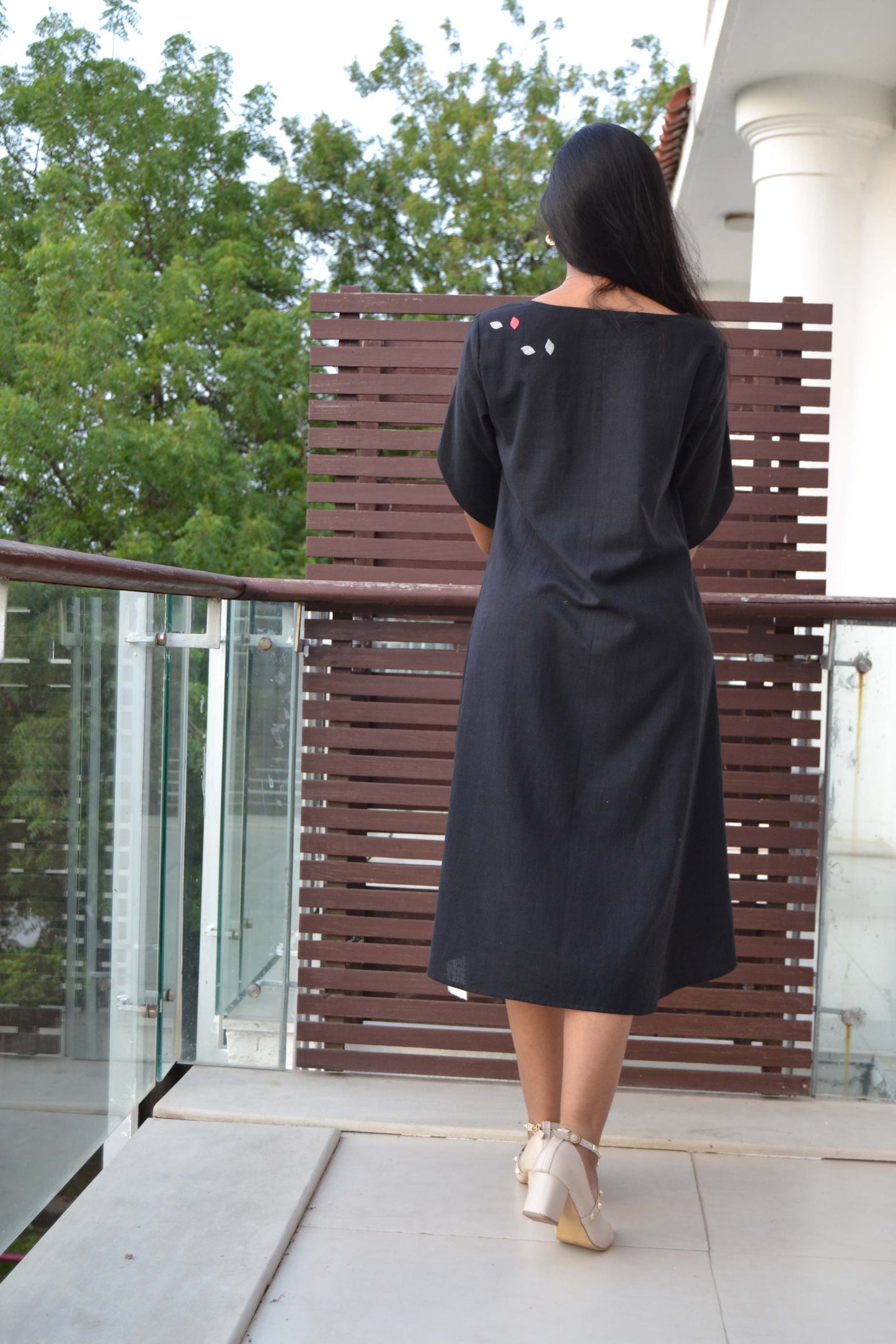 Assymetric dress with patch work 
detail